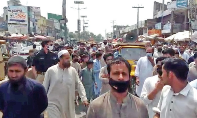 Traders stage a protest in Swabi on Monday. — Dawn Traders stage a protest in Swabi on Monday. — Dawn
