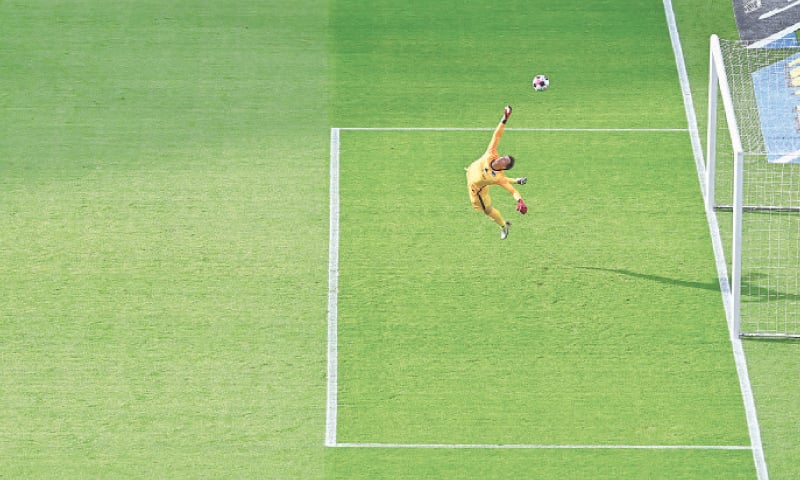 BERLIN: Hertha Berlin&rsquo;s Alexander Schwolow makes a save during the Bundesliga match against Arminia Bielefeld at the Olympiastadion.&mdash;Reuters