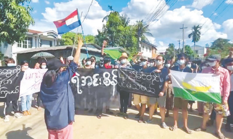 This screengrab taken from AFPTV video shows protesters taking part in a demonstration against the military coup in Yangon.—AFP