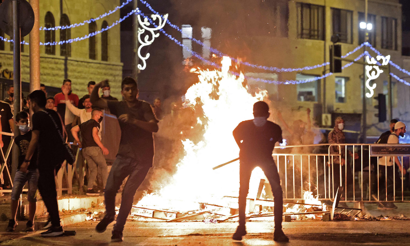 Palestinian protesters hurl stones at Israeli security forces in Jerusalem's Old City. — AFP/File