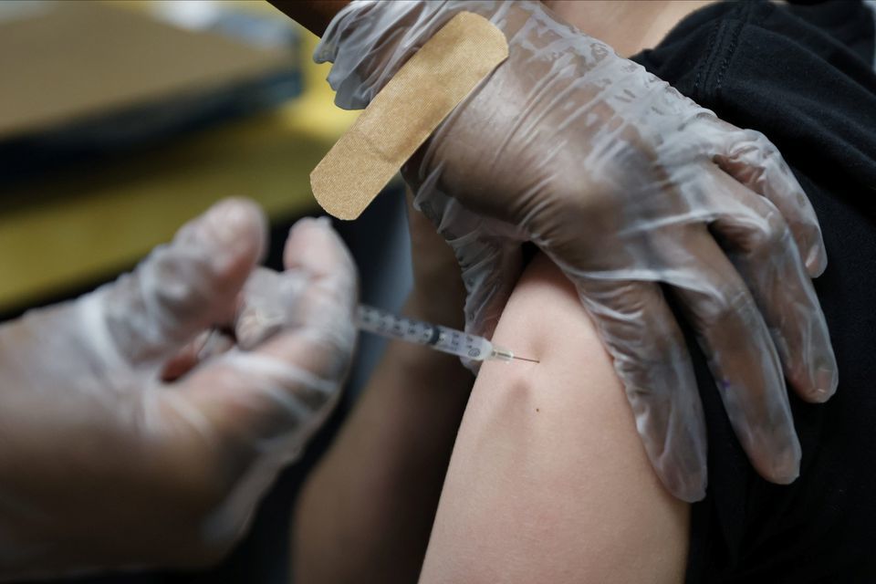 A teenager is inoculated with Pfizer's vaccine against Covid-19 at Dekalb Pediatric Centre in Decatur, Georgia, US, May 11. &mdash; Reuters