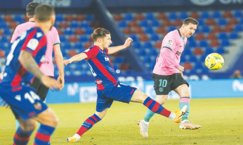 VALENCIA: Barcelona&rsquo;s Lionel Messi vies for the ball with Levante&rsquo;s Enis Bardhi during the La Liga fixture  at the Ciutat de Valencia Stadium.&mdash;AP