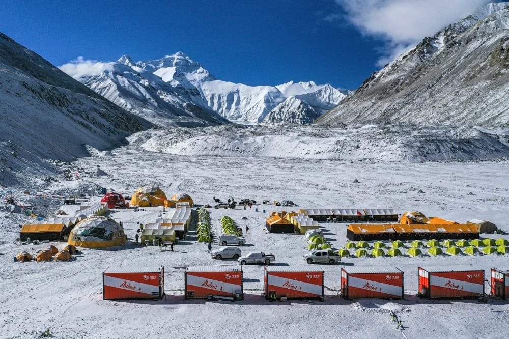 In this file photo released by China's Xinhua News Agency, vehicles and tents are seen at the base camp at the foot of the Chinese side of the peak of Mount Everest. — AP