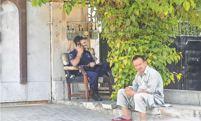 A PRIVATE security guard performs duty outside a bungalow in the city.—Fahim Siddiqi/White Star A PRIVATE security guard performs duty outside a bungalow in the city.—Fahim Siddiqi/White Star
