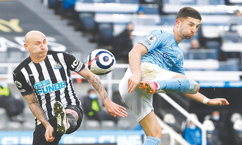 NEWCASTLE: Manchester City’s Ferran Torres (R) scores against Newcastle United during their English Premier League match at St James’ Park.—Reuters