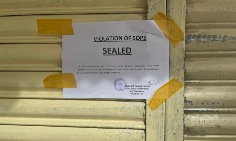 A sign shows a sealed restaurant in Karachi's District South. — Photo courtesy DC Office
