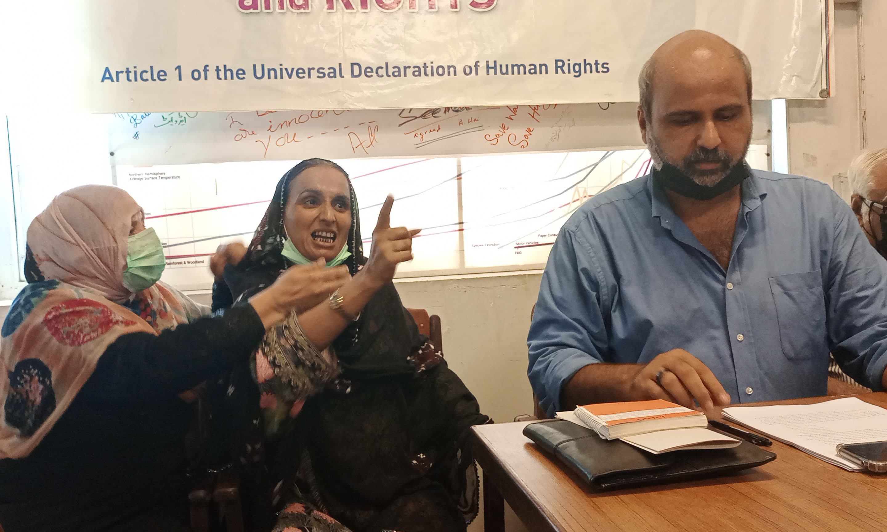 Rozina, the mother of one of the four young men Bilal, becomes hysterical as she demands justice for her dead son at the HRCP office on Tuesday. &mdash; Photo by writer