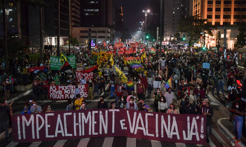 Demonstrators take part in a protest against Brazilian President Jair Bolsonaro's handling of the Covid-19 pandemic in Sao Paulo, Brazil on Saturday. — AFP