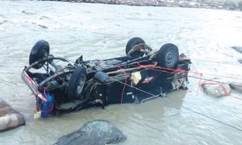 Nine persons drowned when a jeep plunged into the Yarkhoon River after hitting the safety railing of a suspension bridge early on Sunday. — Dawn