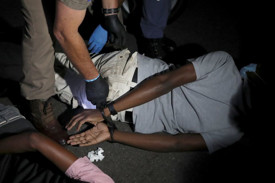 A police officer detains a man during a patrol as a nighttime curfew is reimposed amid a nationwide coronavirus lockdown, in Pretoria, South Africa. — Reuters/File