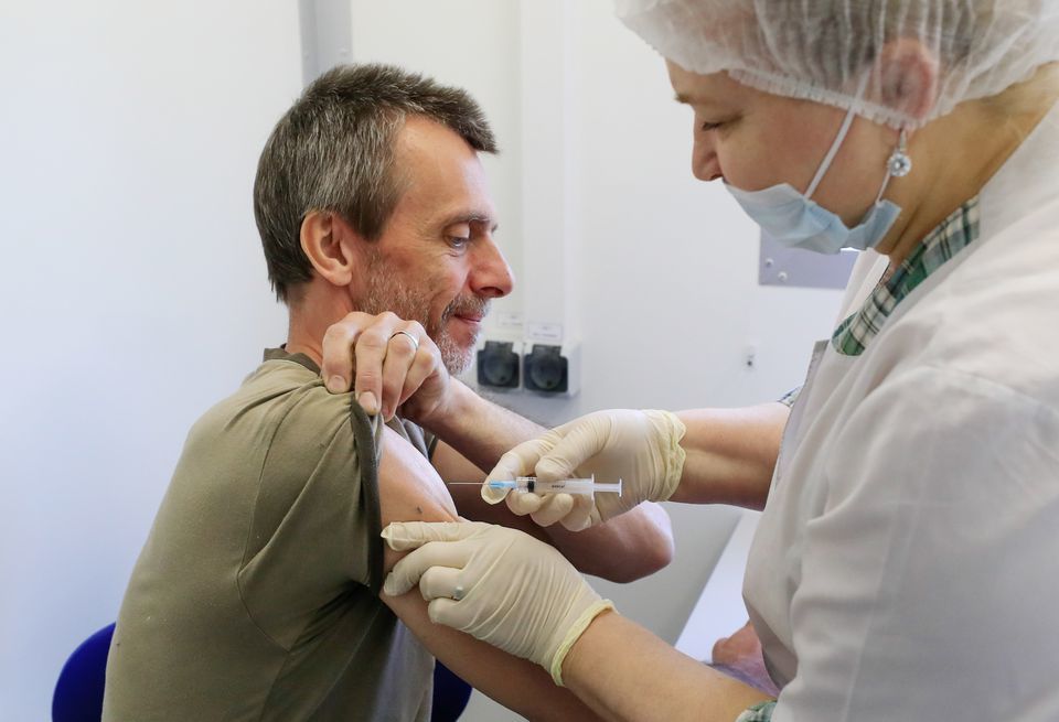 A man receives a dose of Sputnik V vaccine in a dacha community near the village of Poyarkovo in Moscow Region, Russia. &mdash; Reuters/File