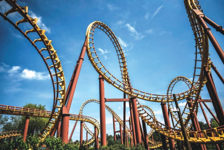 A closed ride is shown at the Asterix amusement park in Plailly, outskirts of Paris, one week before its reopening. Rides running empty, aisles deserted except for staff giving the last turns of the screw and sweeping, Asterix rehearsing its parade in the village — the Asterix amusement park is preparing its reopening this week, with sanitary protocol.—AFP