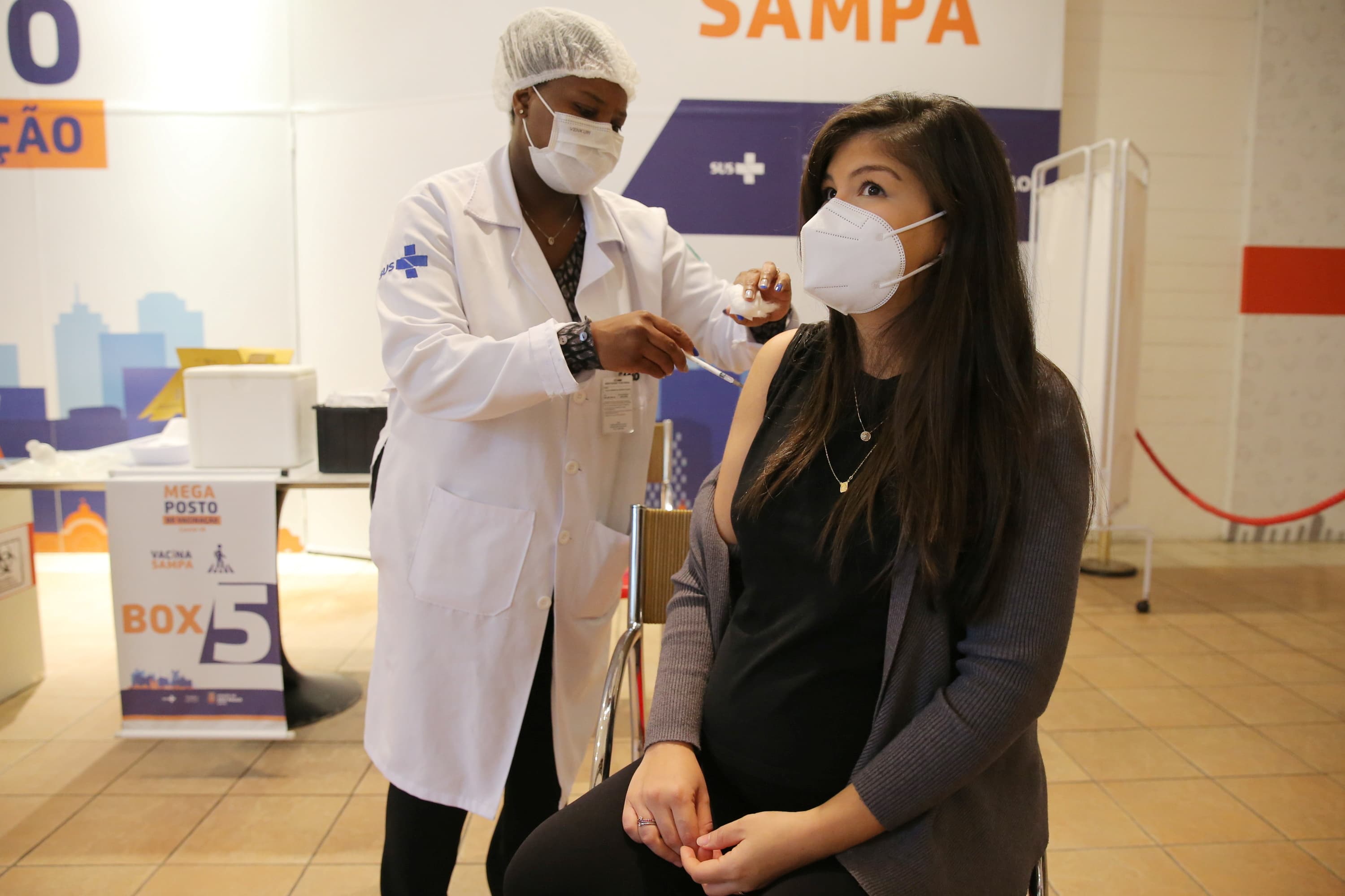 A pregnant Brazilian woman, Fernanda de Assis, receives a dose of Pfizer/BioNTech vaccine in Sao Paulo. — Reuters