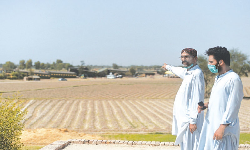 ALI Nawaz points to the site of the tragedy in Daharki.&mdash;AFP