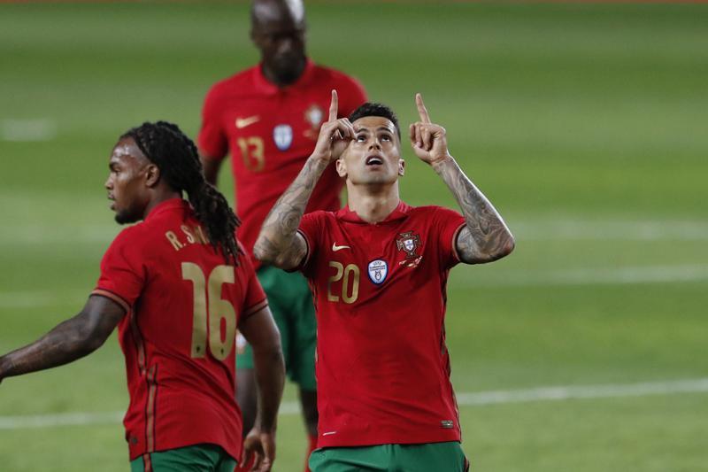 Portugal's Joao Cancelo celebrates after scoring his side's third goal during the international friendly football match between Portugal and Israel at the Alvalade stadium in Lisbon, June 9. &mdash; AP
