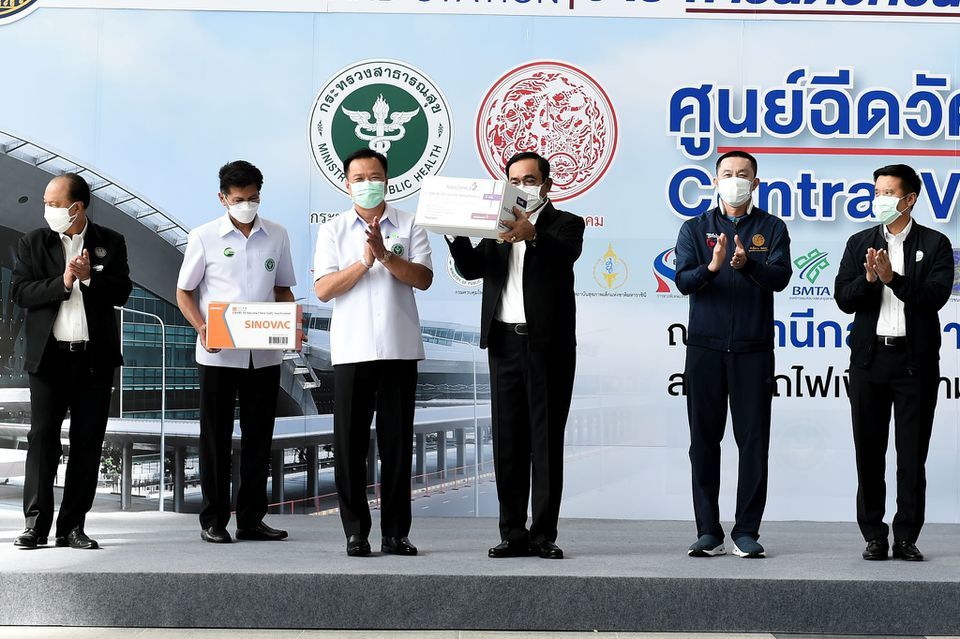 Thailand's Prime Minister Prayuth Chan-ocha holds a box containing AstraZeneca vaccines as the country starts a mass inoculation campaign, in Bangkok, Thailand, June 7. — Reuters