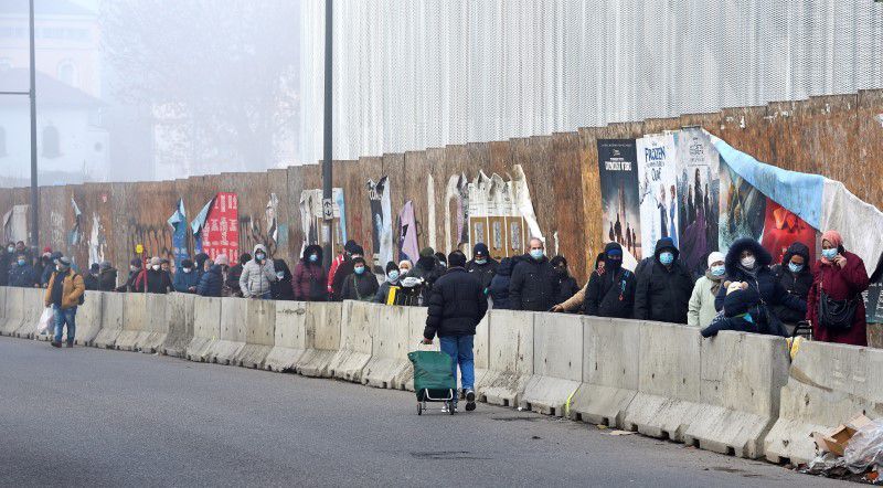 People queue for free food as Italians struggle to cope in a tough economic climate amid the coronavirus pandemic in Milan, Italy. — Reuters/File