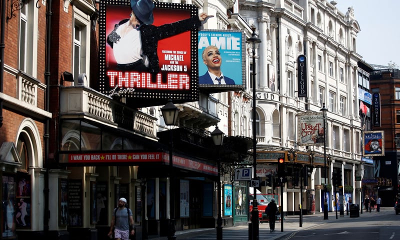 A man walks past the Lyric Theatre at London's West End amid the spread of the Covid-19 in London, Britain. — Reuters