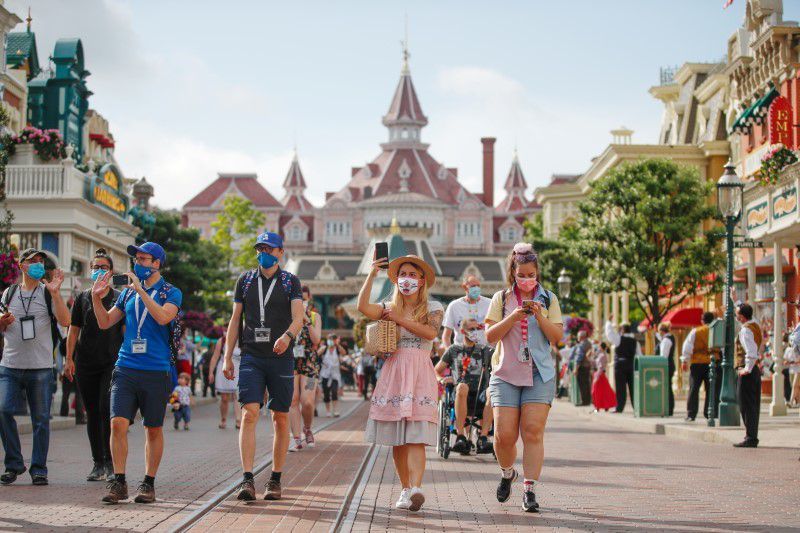 Visitors wear protective face masks at Disneyland Paris as the theme park reopens its doors to the public in Marne-la-Vallee, near Paris, France, June 17. &mdash; Reuters