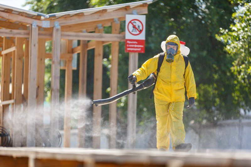 A specialist wearing personal protective equipment sprays disinfectant while sanitising the Rizhsky Railway Station in Moscow, Russia, June 17. — Reuters