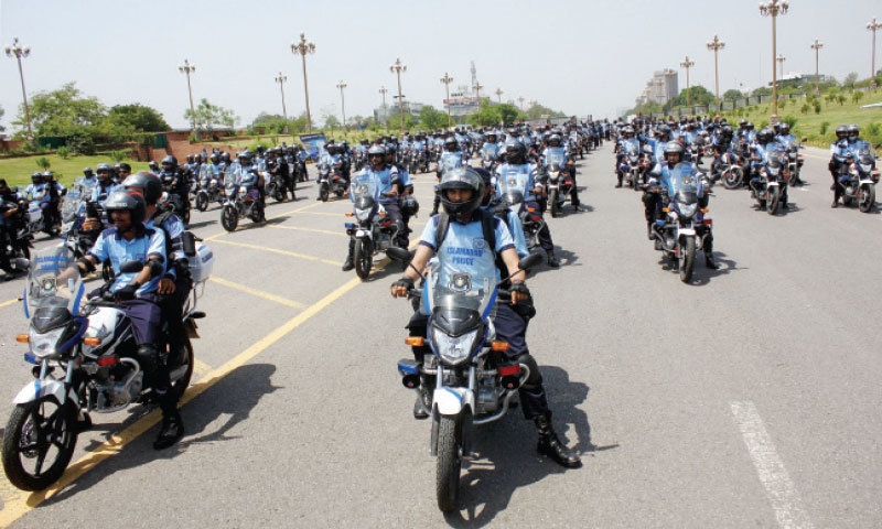 The newly-inaugurated Eagle Squad of the capital police get ready to conduct a flag march in Islamabad on Friday. — Photo by Mohammad Asim