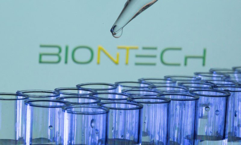 Test tubes are seen in front of a displayed Biontech logo in this illustration. — Reuters/File