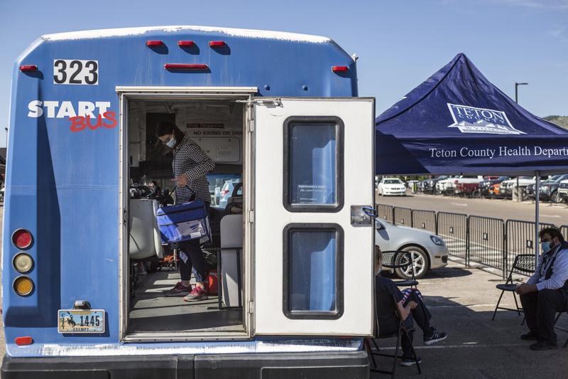 Jhala French packs up the Teton County Health Department's Vaxi Taxi after its stop at Jackson Hole Airport north of Jackson, Wyo, US, June 14. &mdash; AP
