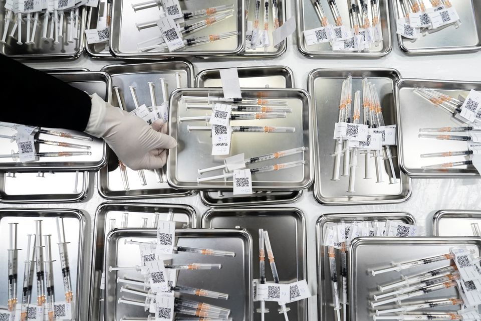 AstraZeneca Covid-19 vaccine syringes are prepared as people are vaccinated at the Central Vaccination Centre, inside the Bang Sue Grand Station, Thailand, June 21. — Reuters