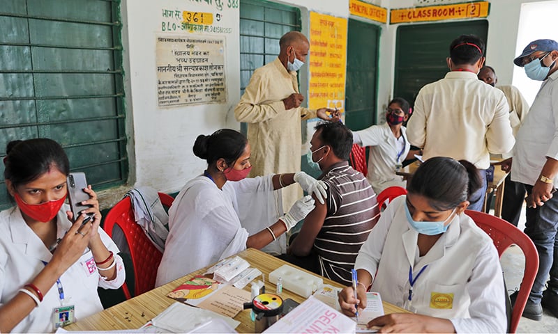 A vaccination drive against Covid-19 is in progress at a government school in Amritpur village, Uttar Pradesh state, India on Monday. — AP