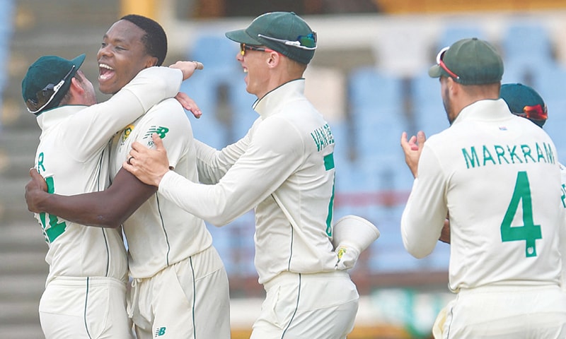 GROS ISLET: South African pacer Kagiso Rabada (second L) celebrates with team-mates after dismissing Shai Hope of West Indies during the second Test at Darren Sammy Cricket Ground on Monday.—AFP