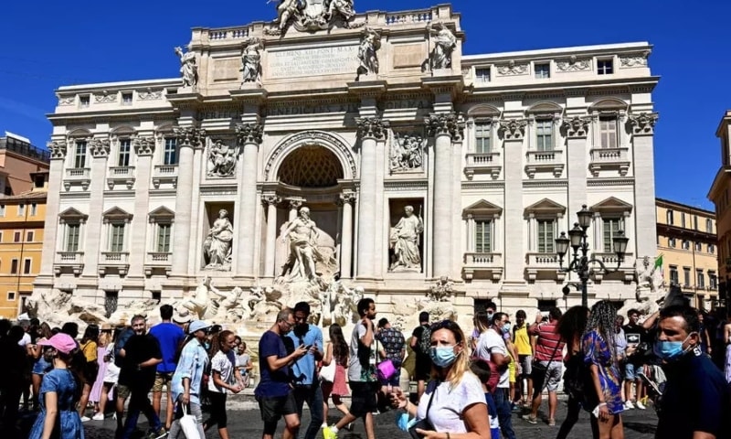 Tourists at the Trevi fountain in Rome on August 19, 2020. — AFP