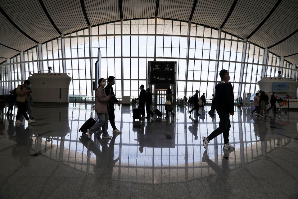 Travellers are seen at the Beijing Daxing International Airport on the first day of Labour Day holiday, in Beijing, China, May 1. &mdash; Reuters