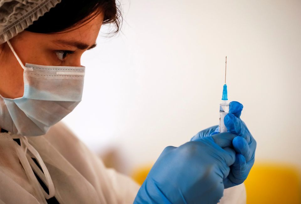 A healthcare worker prepares a dose of Sputnik V vaccine at a vaccination centre in Depo food mall in Moscow, Russia, June 17. &mdash; Reuters