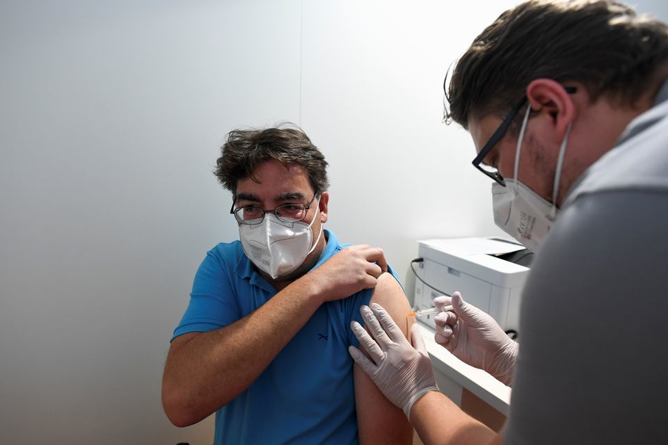 A man receives his shot at a vaccination centre, Munich, Germany, May 13. — Reuters