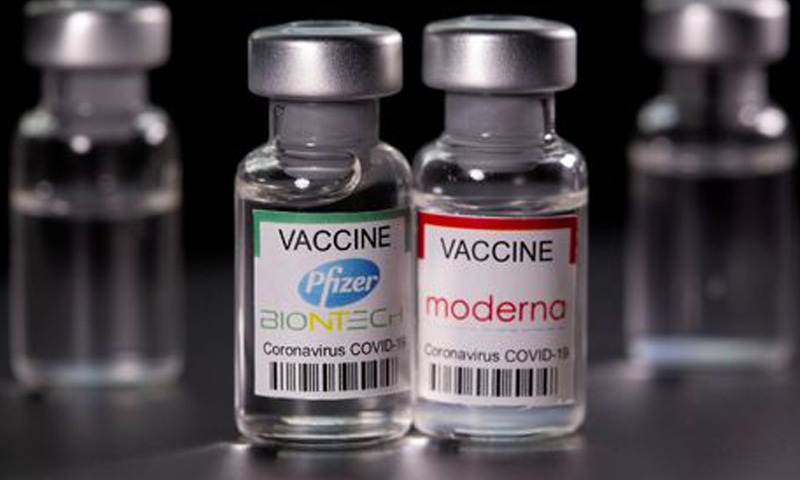 Vials with Pfizer-BioNTech and Moderna Covid-19 vaccine labels are seen in this illustration picture. &mdash; Reuters