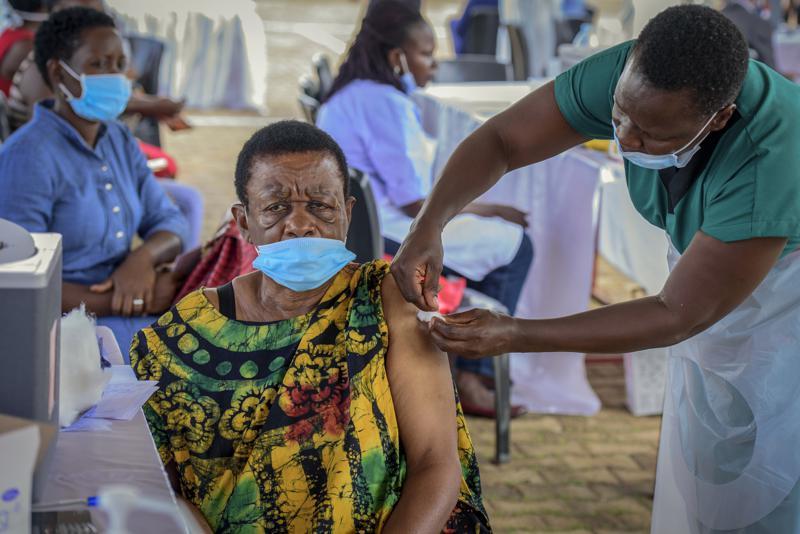 A woman receives a coronavirus vaccination at the Kololo airstrip in Kampala, Uganda, May 31. &mdash; AP