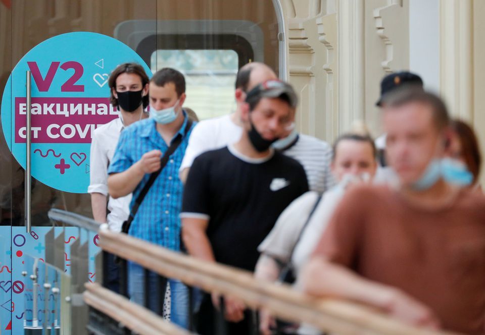 People line up to receive vaccine against the coronavirus outside a vaccination centre in the State Department Store, GUM, in central Moscow, Russia, June 25. — Reuters