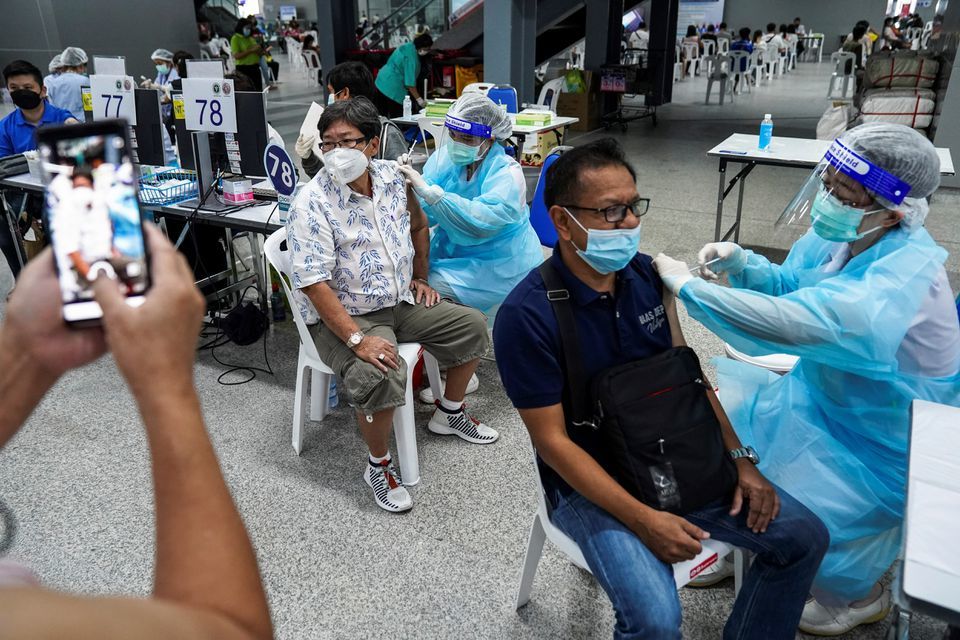 People receive the first dose of AstraZeneca Covid-19 vaccine at the Central Vaccination Centre, inside the Bang Sue Grand Station, Thailand, June 21. — Reuters