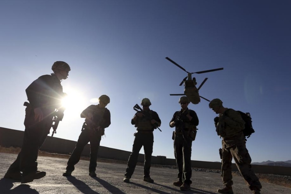 In this Nov 30, 2017, file photo, American soldiers wait on the tarmac in Logar province, Afghanistan. — AP