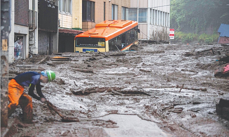 ATAMI (Japan): Mud and debris clog a street after a fatal landslide devastated this town in the country&rsquo;s Shizuoka Prefecture on Saturday. &mdash; AFP
