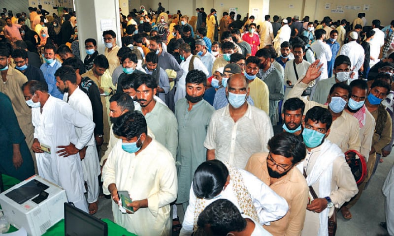 Hundreds of people aspiring to go abroad queued up at Expo Centre for coronavirus vaccination on Monday.