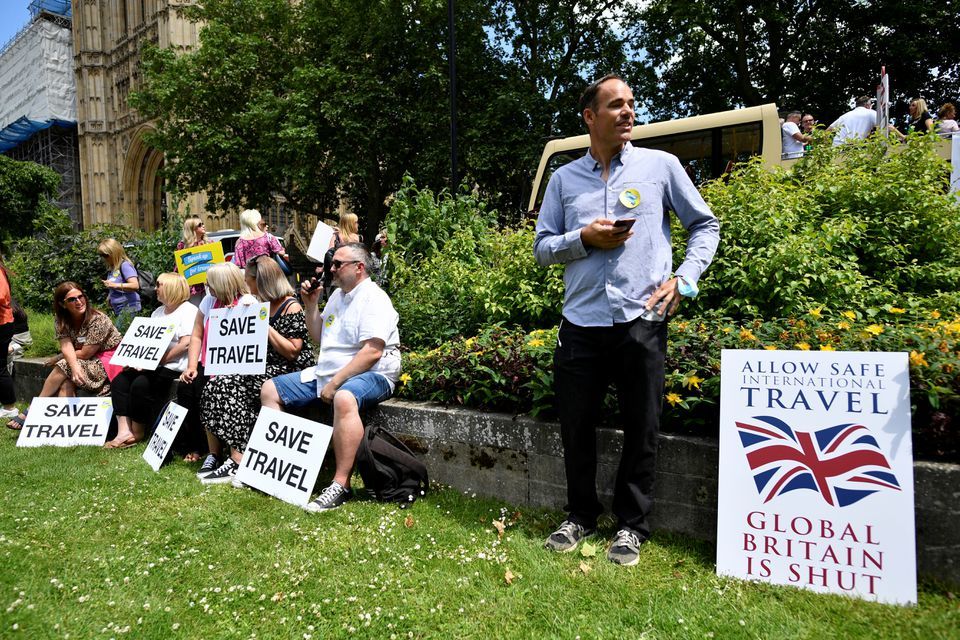 People demonstrate against the current coronavirus travel restrictions, in London, Britain, June 23. — Reuters