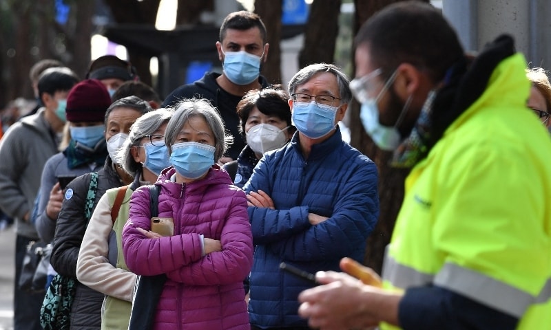 Sydneysiders wait in a queue outside a Covid-19 vaccination centre in the Homebush suburb on July 7. — AFP