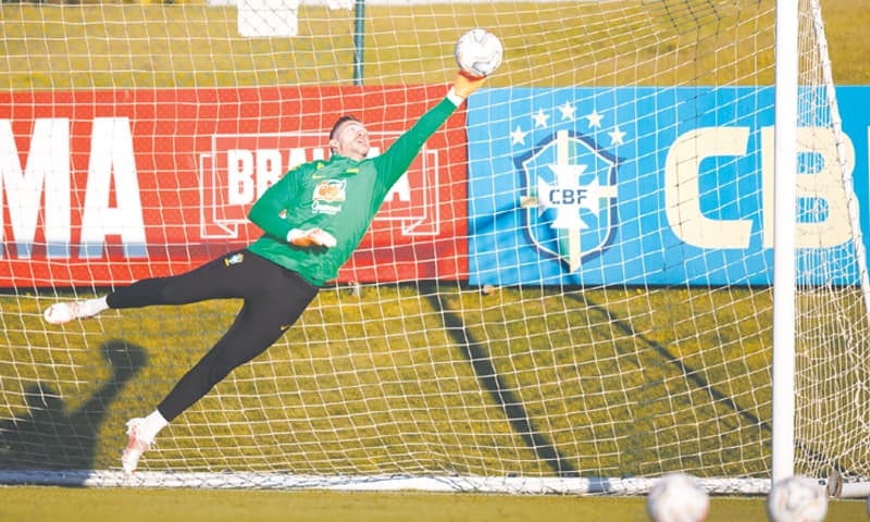 RIO DE JANEIRO: Brazil goalkeeper Ederson makes a save during a training session at the Granja Comary training centre in Teresopolis on Thursday. — AFP
