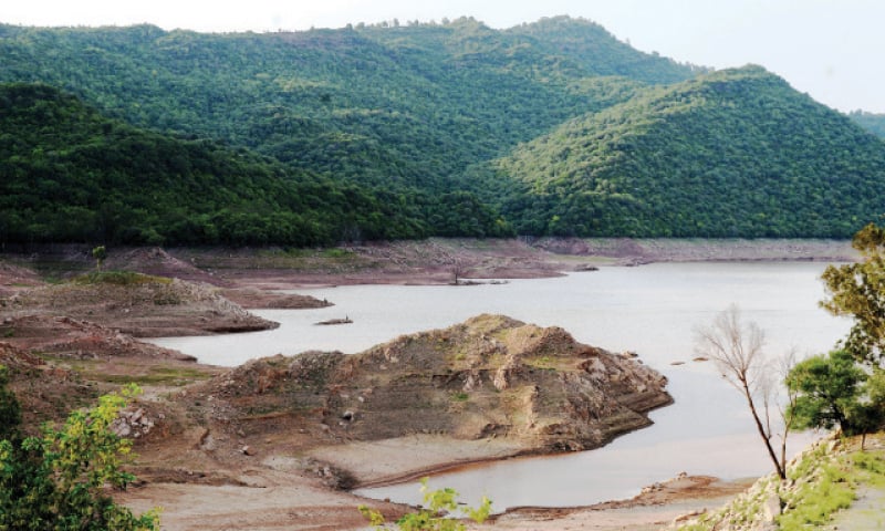 Water level in Simly Dam has decreased due to low rains in the catchment areas. However, officials say water in the dam is sufficient to meet the needs of residents for one month. — Photo by Mohammad Asim