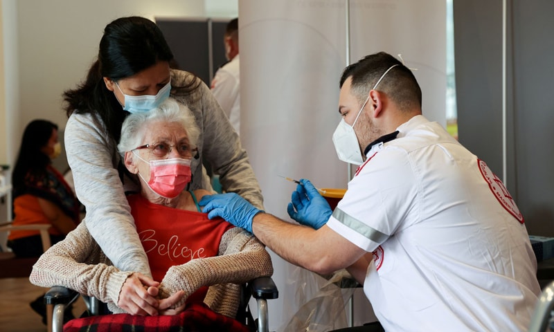In this file photo, an elderly woman receives a booster shot against Covid-19 at an assisted living facility in Netanya, Israel. — Reuters/File