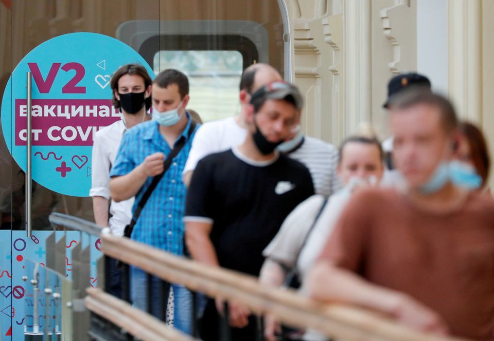 People line up to receive Covid-19 vaccine outside a vaccination centre in the State Department Store, GUM, in central Moscow, Russia, June 25. — Reuters