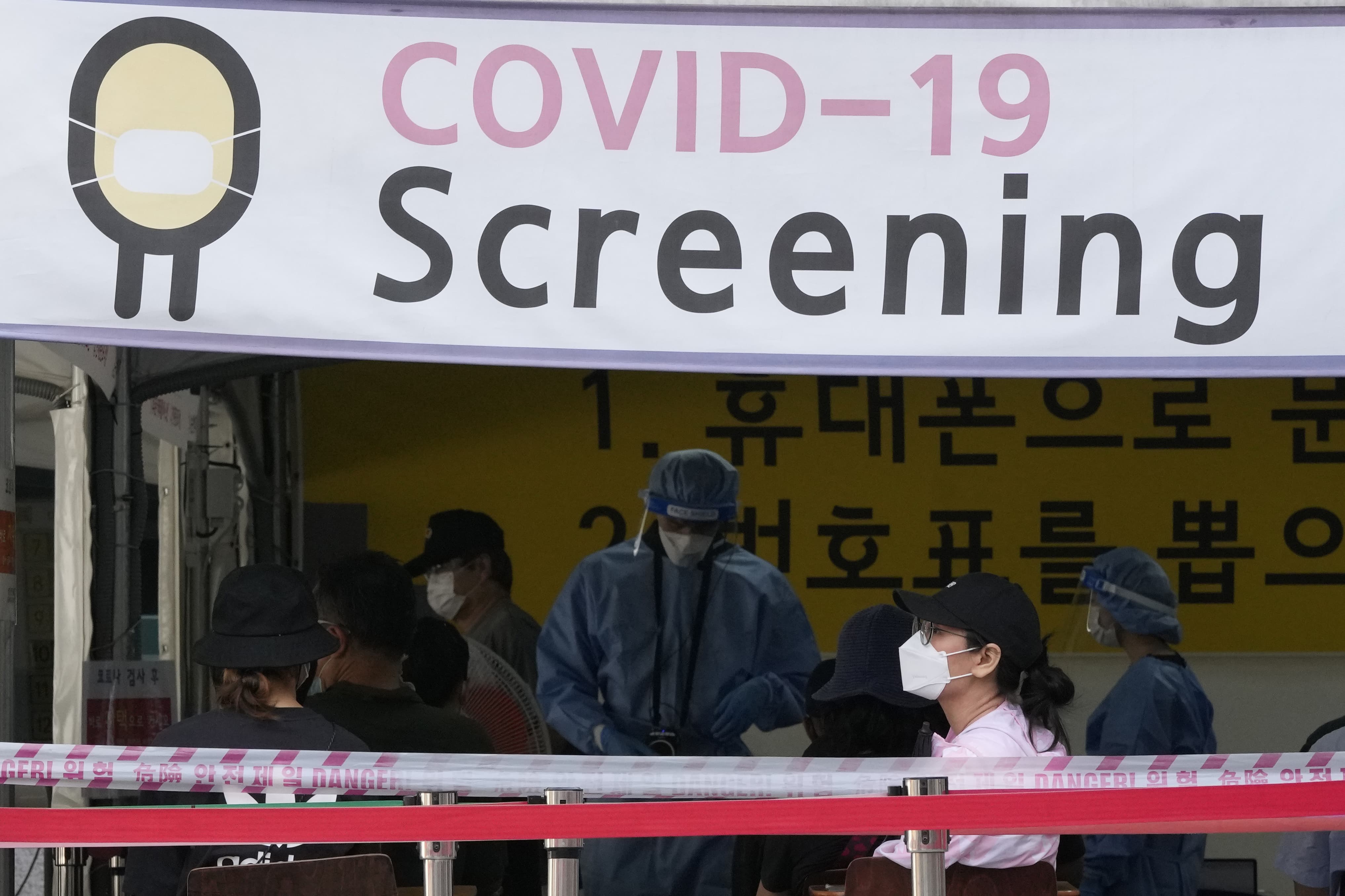 A woman waits to get coronavirus testing at a public health centre in Seoul on July 14. — AP