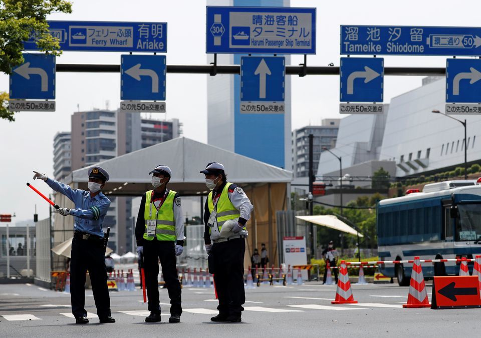 Police officers and security personnel stand guard at the entrance of the Athletes Village ahead of the Tokyo 2020 Olympic Games in Tokyo, Japan, July 13. &mdash; Reuters