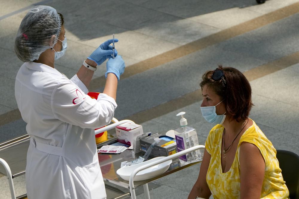 A medical worker prepares to give an injection of Russia's Sputnik V coronavirus vaccine at a vaccination centre in Gostiny Dvor, Moscow, Russia, July 13. &mdash; AP